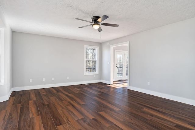 unfurnished room with ceiling fan, dark hardwood / wood-style floors, and a textured ceiling