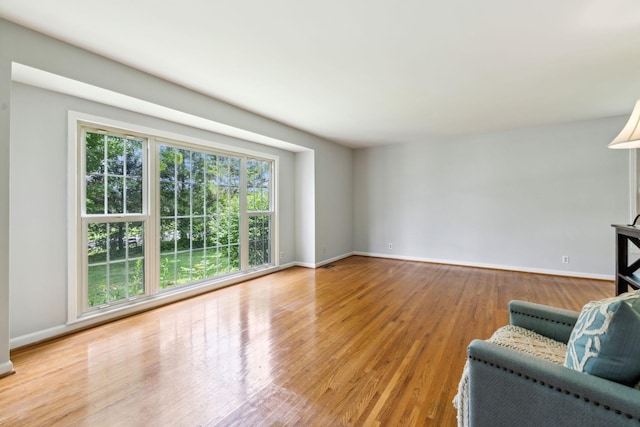 unfurnished living room with light hardwood / wood-style flooring