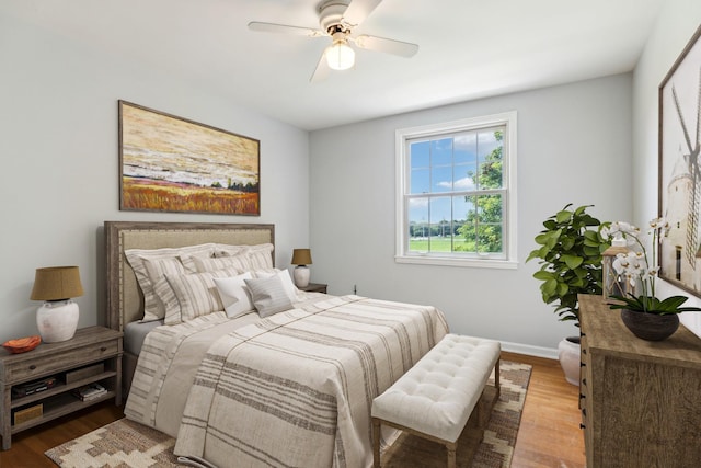 bedroom featuring hardwood / wood-style flooring and ceiling fan