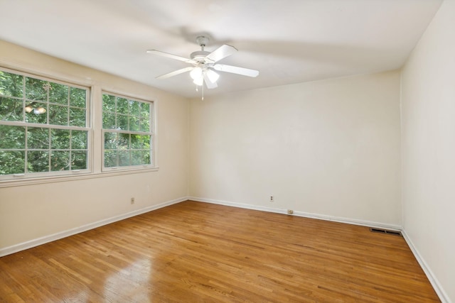 spare room featuring ceiling fan and wood-type flooring