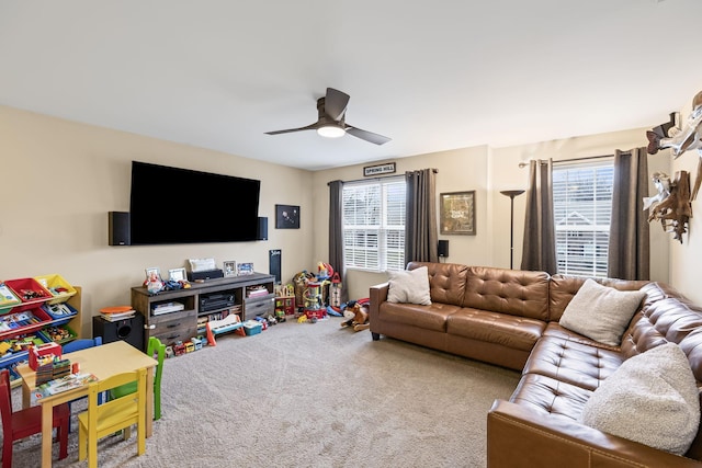 carpeted living room featuring ceiling fan