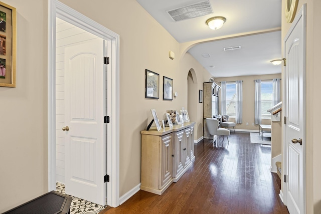 hallway featuring dark wood-type flooring