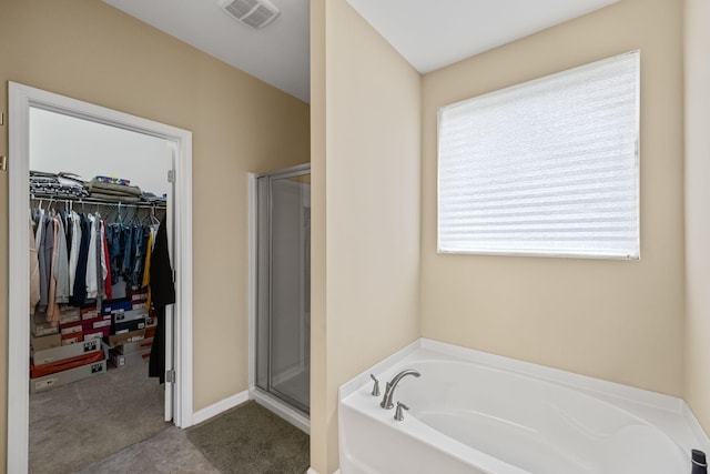 bathroom featuring plus walk in shower