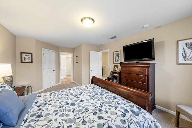 bedroom featuring light carpet