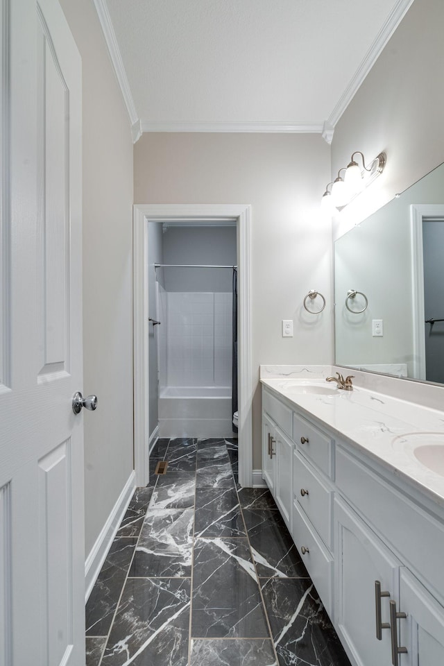 bathroom with ornamental molding, vanity, and shower / bathing tub combination