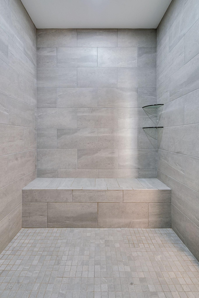 bathroom with a tile shower