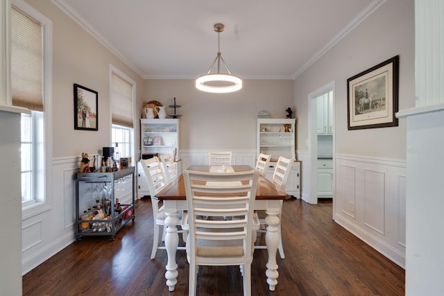 dining room featuring crown molding and dark wood-type flooring