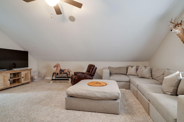 living room featuring carpet floors, ceiling fan, and vaulted ceiling