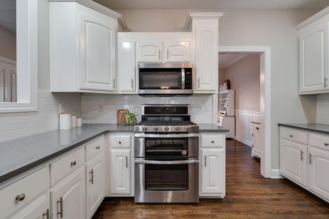 kitchen featuring white cabinetry and appliances with stainless steel finishes