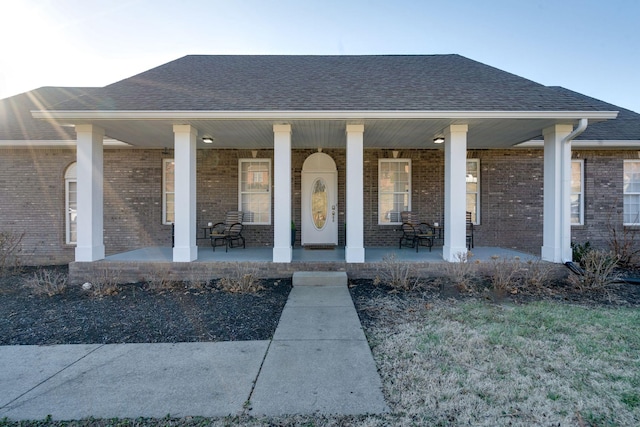 doorway to property featuring a porch