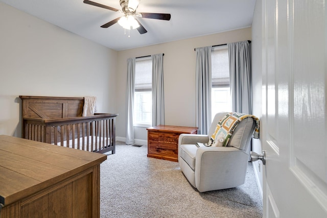 carpeted bedroom with ceiling fan