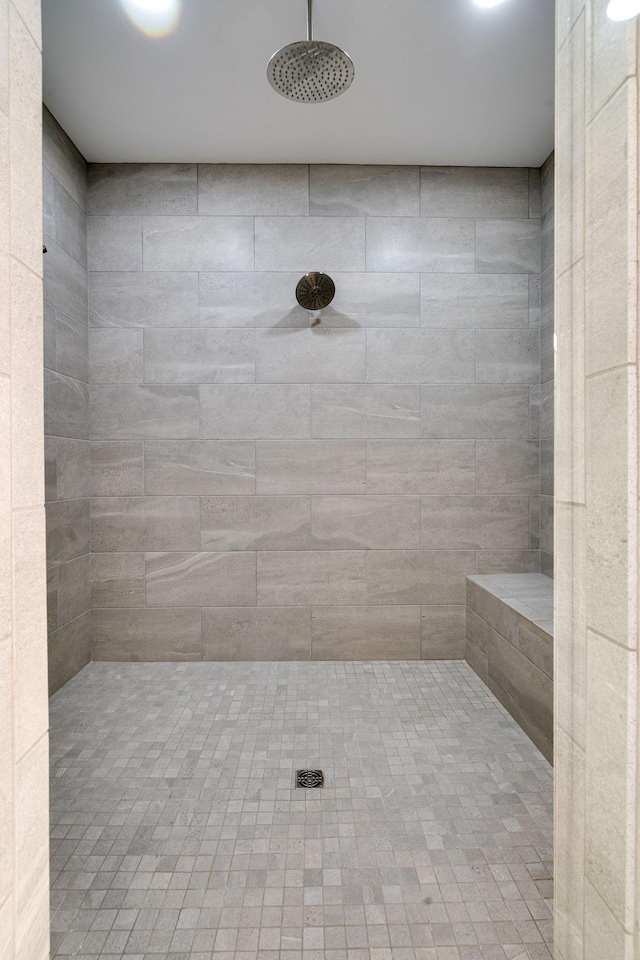 bathroom with tiled shower