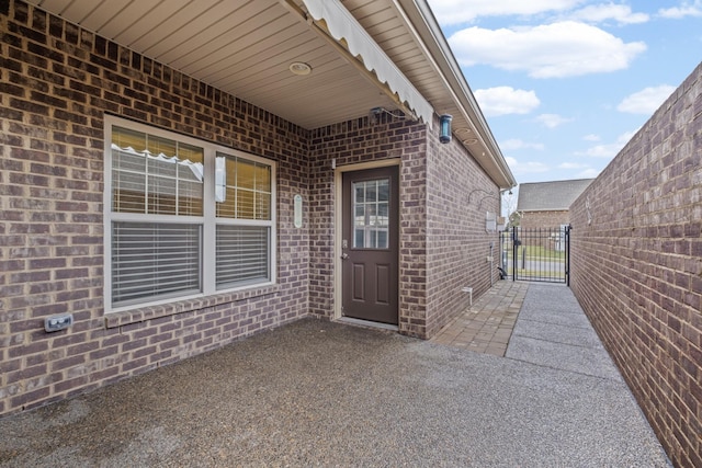 doorway to property featuring a patio area