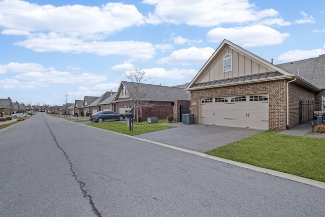 exterior space with central AC unit and a garage