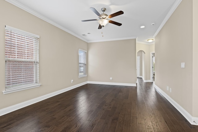 empty room featuring ceiling fan, ornamental molding, and dark hardwood / wood-style floors