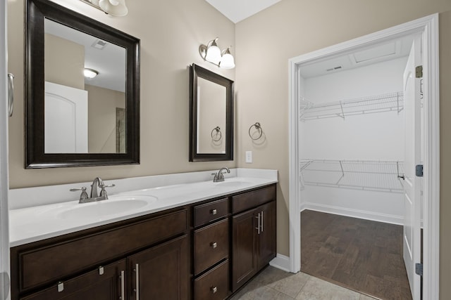 bathroom featuring tile patterned flooring and vanity