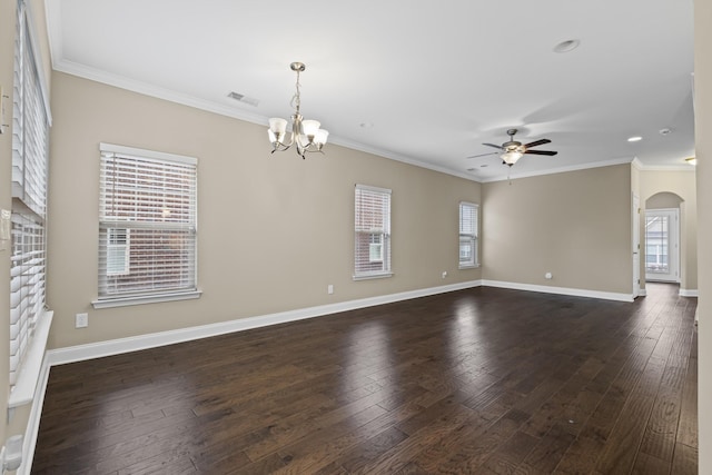 unfurnished room featuring dark wood-type flooring, ornamental molding, and ceiling fan with notable chandelier