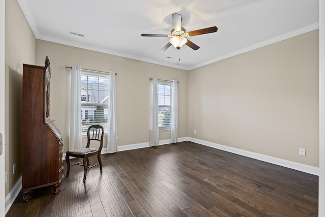 spare room with ceiling fan, ornamental molding, and dark hardwood / wood-style floors