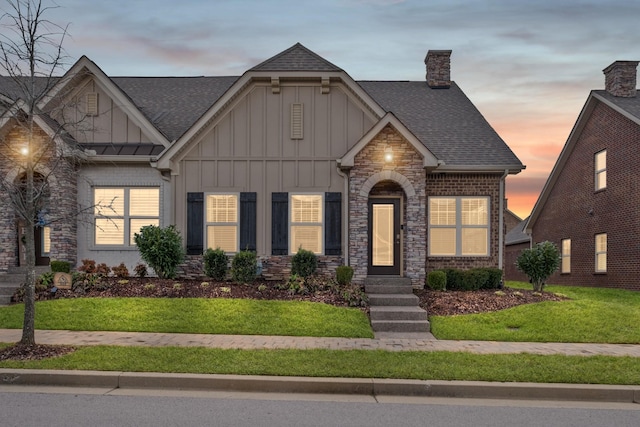 view of front of house with a yard