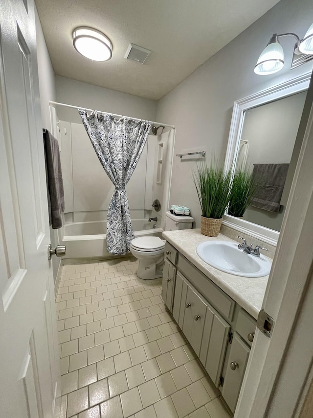 full bathroom with shower / bathtub combination with curtain, tile patterned flooring, vanity, a textured ceiling, and toilet