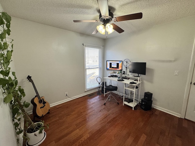 office with dark hardwood / wood-style flooring, ceiling fan, and a textured ceiling