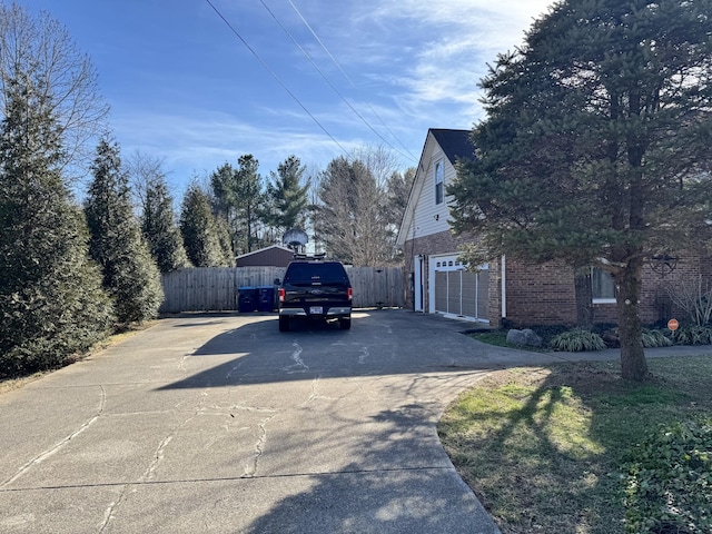 view of side of home with a garage