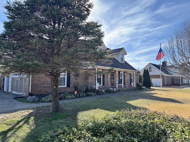 view of front of home with a garage and a front lawn