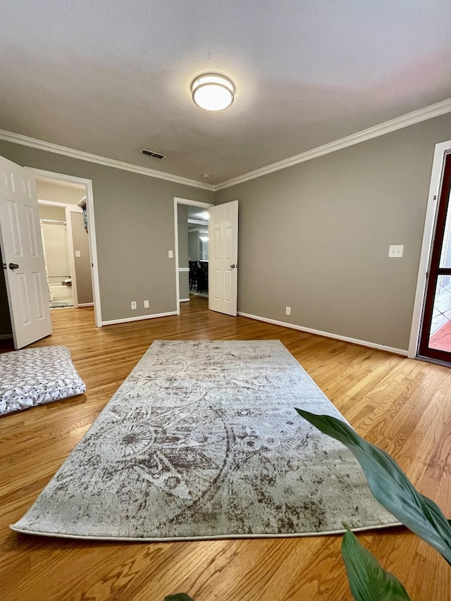 interior space featuring ornamental molding and wood-type flooring