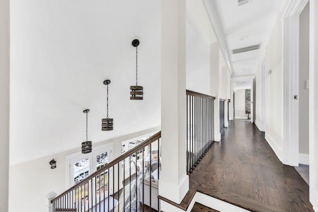 hall with dark hardwood / wood-style flooring