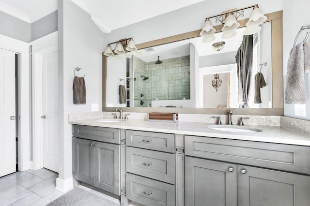 bathroom with vanity and a shower with door