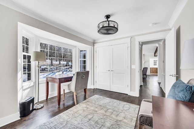 home office with crown molding, a healthy amount of sunlight, and dark hardwood / wood-style floors