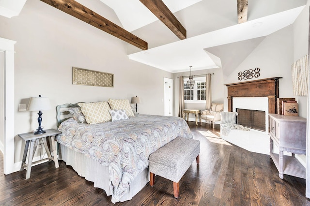 bedroom featuring dark hardwood / wood-style flooring and vaulted ceiling with beams