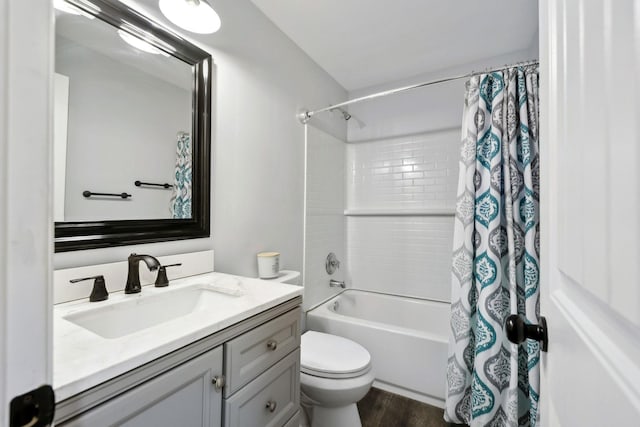 full bathroom with shower / bath combination with curtain, vanity, toilet, and hardwood / wood-style floors