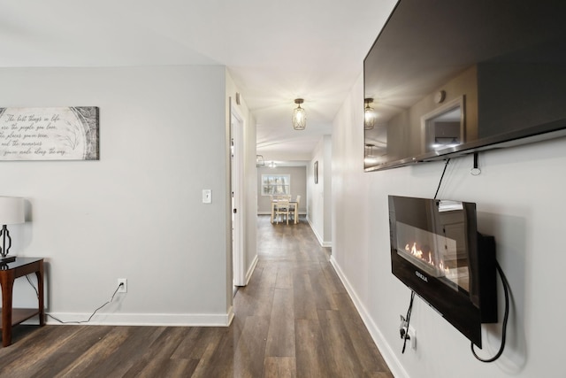 corridor featuring dark hardwood / wood-style flooring