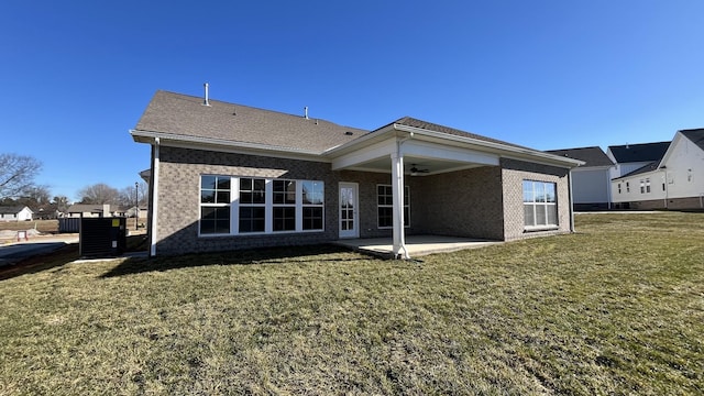 back of house featuring a yard, a patio, and ceiling fan