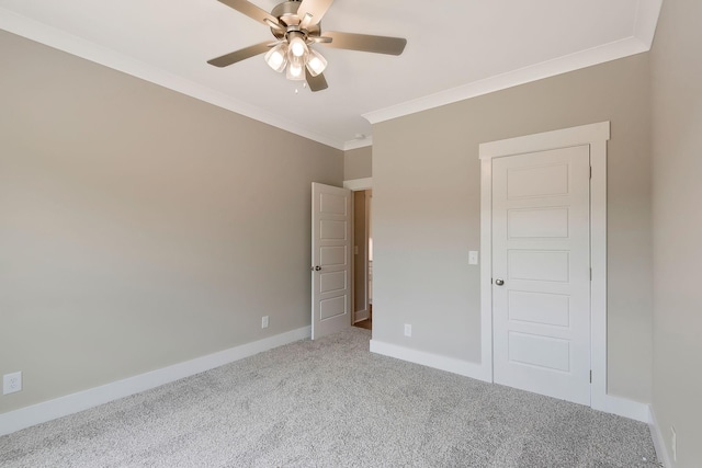 unfurnished bedroom featuring crown molding, ceiling fan, and carpet flooring