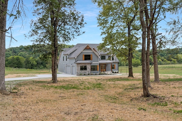 view of front of property with a garage and covered porch