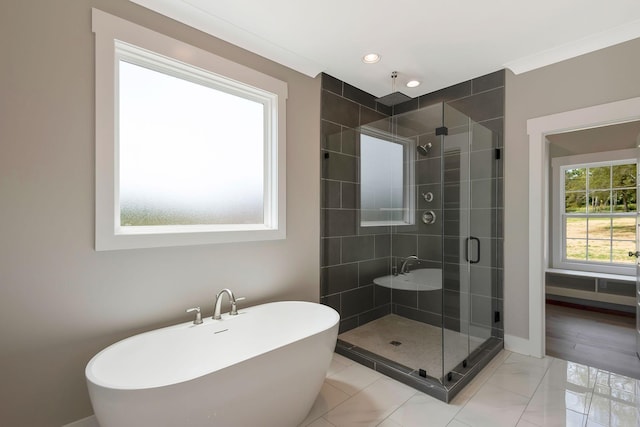 bathroom featuring shower with separate bathtub