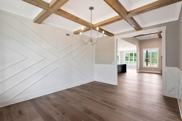 unfurnished dining area with dark hardwood / wood-style floors, a notable chandelier, coffered ceiling, and beamed ceiling