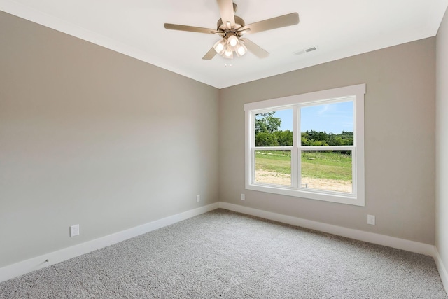 carpeted spare room featuring ceiling fan