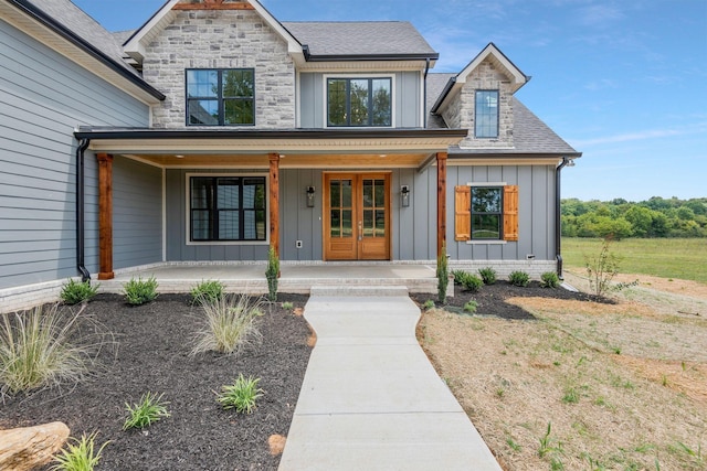 view of front of home with french doors and a porch