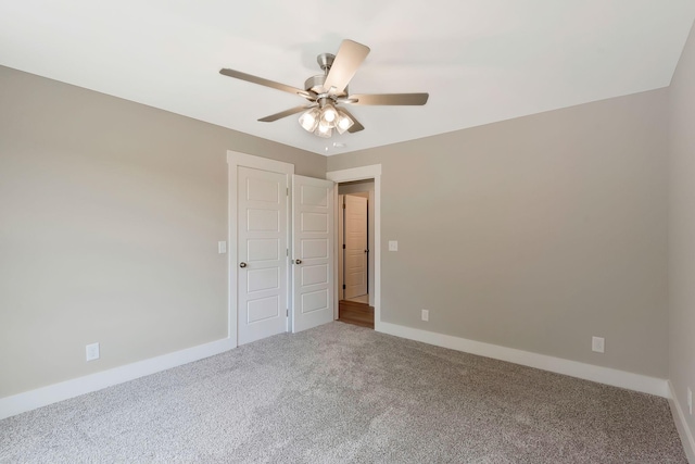 carpeted empty room with ceiling fan