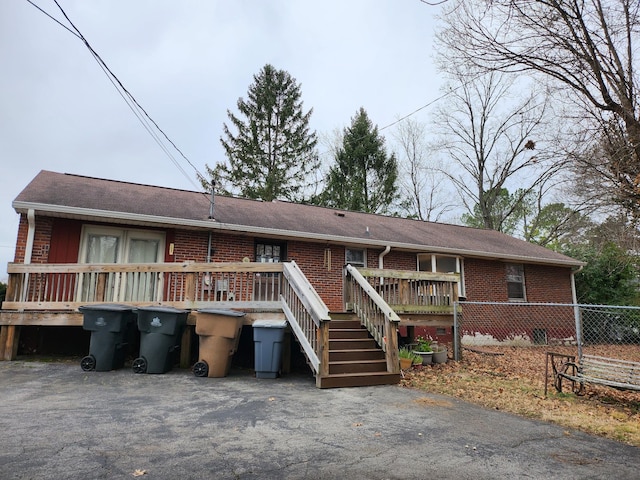 view of front of home with a wooden deck