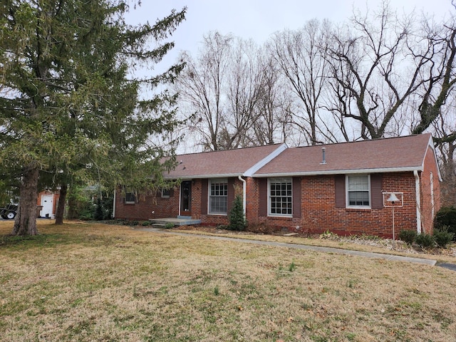 ranch-style home with a front yard