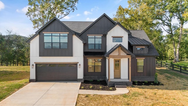 view of front of house featuring a garage and a front yard