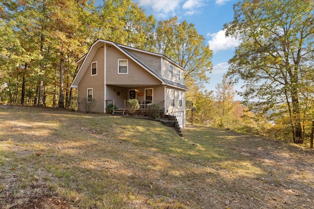 front of property with a porch and a front yard