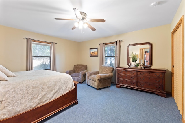 bedroom with multiple windows, carpet, and ceiling fan