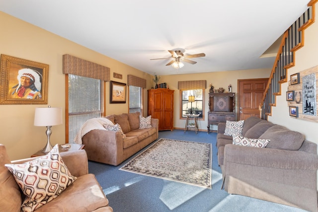 living room with carpet floors and ceiling fan