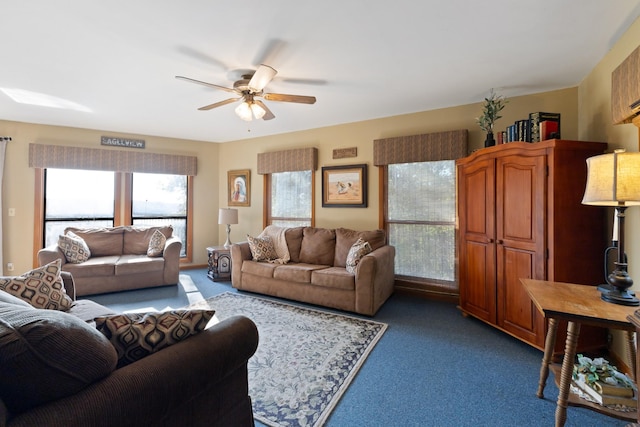 carpeted living room featuring ceiling fan