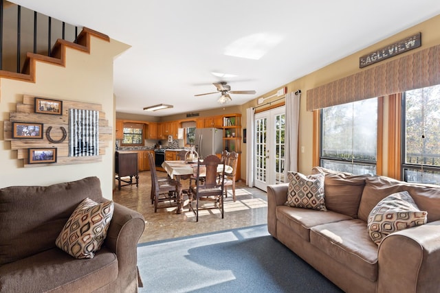 living room with french doors and ceiling fan